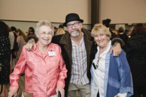 Greg Piercy poses with esteemed guests at the Hilltop Artists Better Futures Luncheon