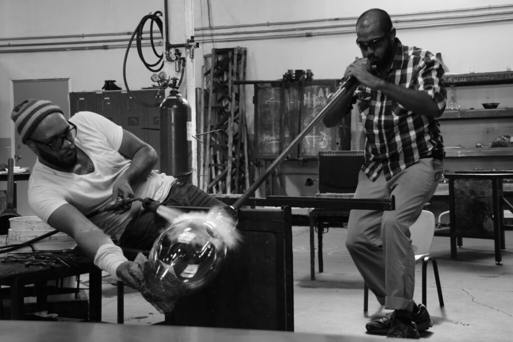 Artist Nate Watson is assisted by Hilltop Artists alum Jason McDonald