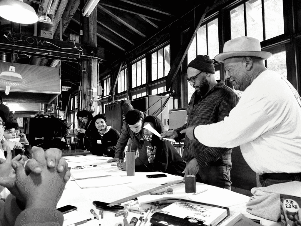 Artists Therman Statum and Nate Watson work with Hilltop Artists students at Pilchuck Glass School