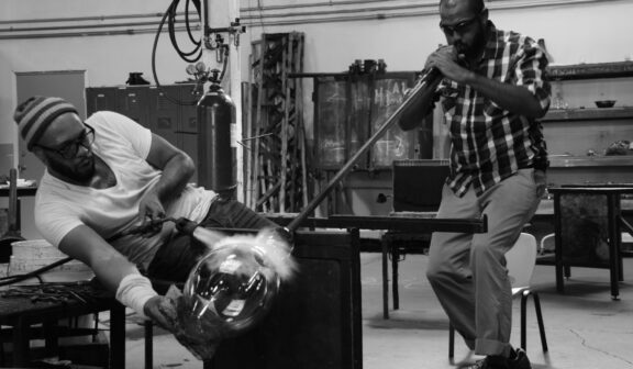 Artist Nate Watson is assisted by Hilltop Artists alum Jason McDonald