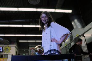 Hilltop Artist Ellye works on a piece in the hot shop
