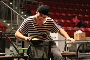 Hilltop Artist Jacob working on the bench during a demonstration at MoG