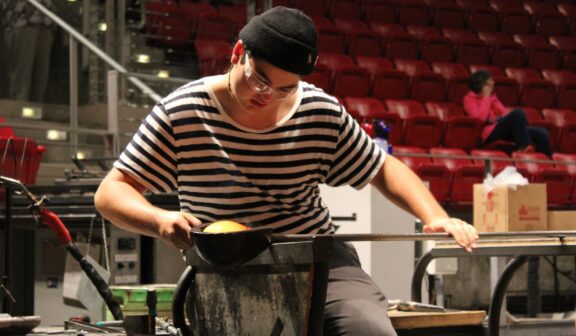 Hilltop Artist Jacob working on the bench during a demonstration at MoG