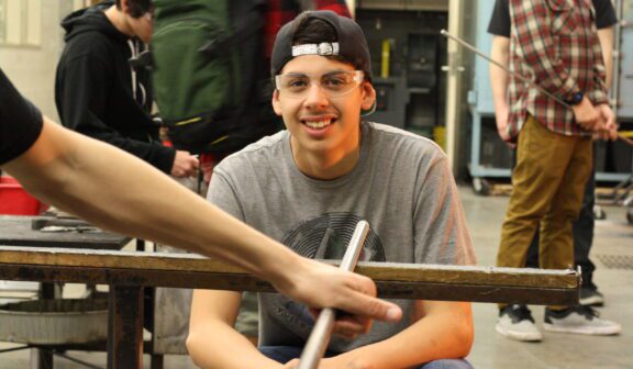 Hilltop Artist Kenny in the hot shop during a demonstration.