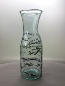Image of a signed glass vessel created by Hilltop Artists alum, Paris.