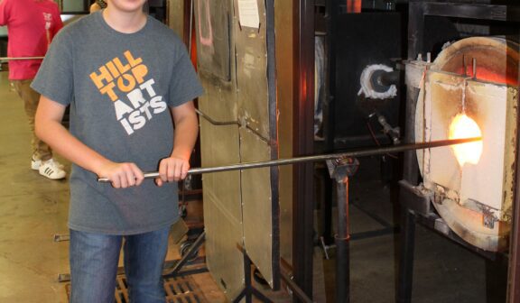 Hilltop Artist Zach in the hot shop at Hilltop Heritage MS
