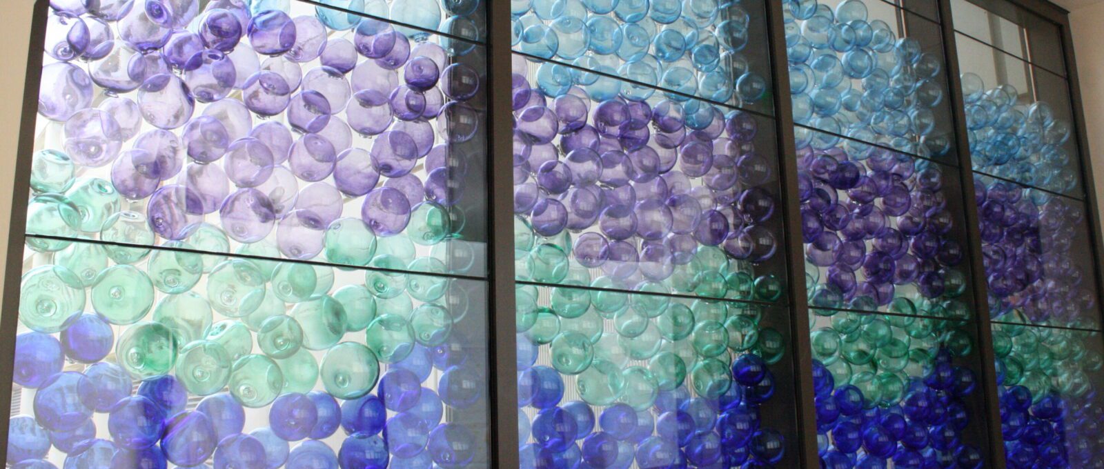 Photograph of an installation of glass floats produced and installed at Mary Bridge Childrens' Hospital by Hilltop Artists
