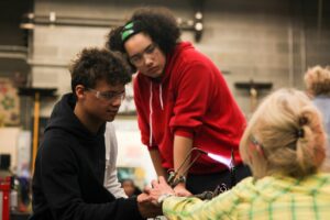 Hilltop Artists students and instructors work on a piece together during the after school program.