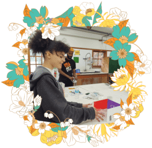 Student Destiny creates a glass house with artists Therman Statum and Cedric Mitchell