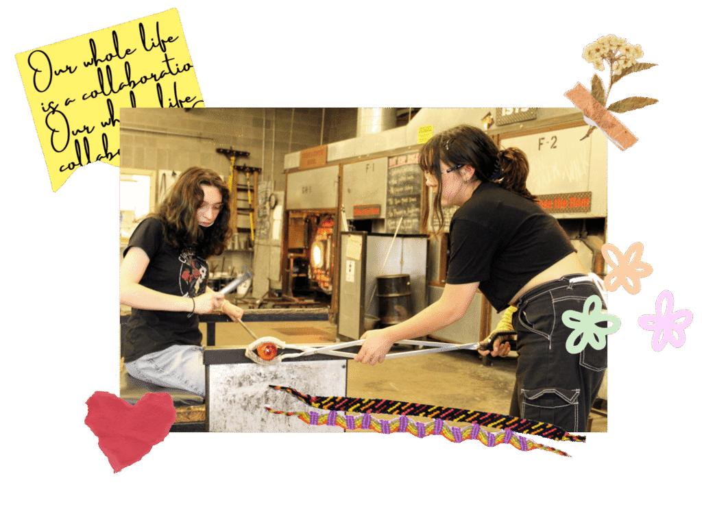 Hilltop Artists Lily and Jasmine collaborate on a piece in the hot shop.