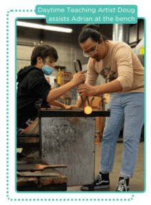 Daytime teaching artist Doug assists a student at the bench