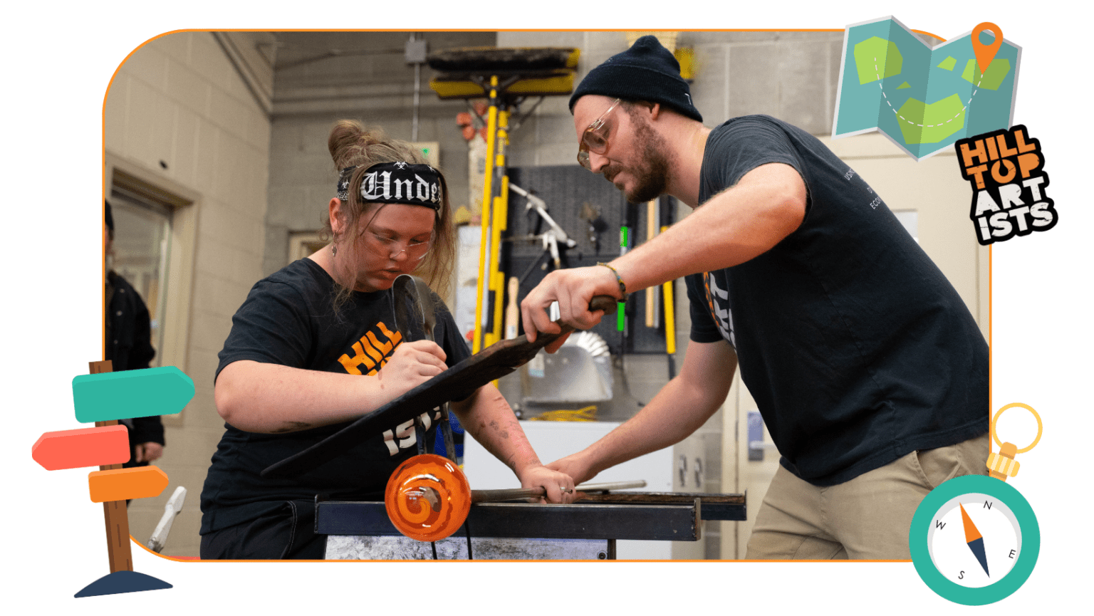 Hilltop Artists instructor, Jonathan, assists student Dasein on the glassblowing bench
