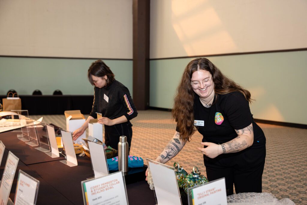 Photo of Hilltop Artists instructor Carleigh volunteering at the Better Futures Luncheon