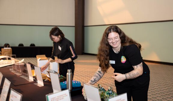 Photo of Hilltop Artists instructor Carleigh volunteering at the Better Futures Luncheon