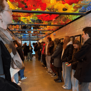 Image of Hilltop Artists students during a tour of the Chihuly Boathouse.