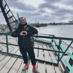 David Rios posed on a bridge during a trip